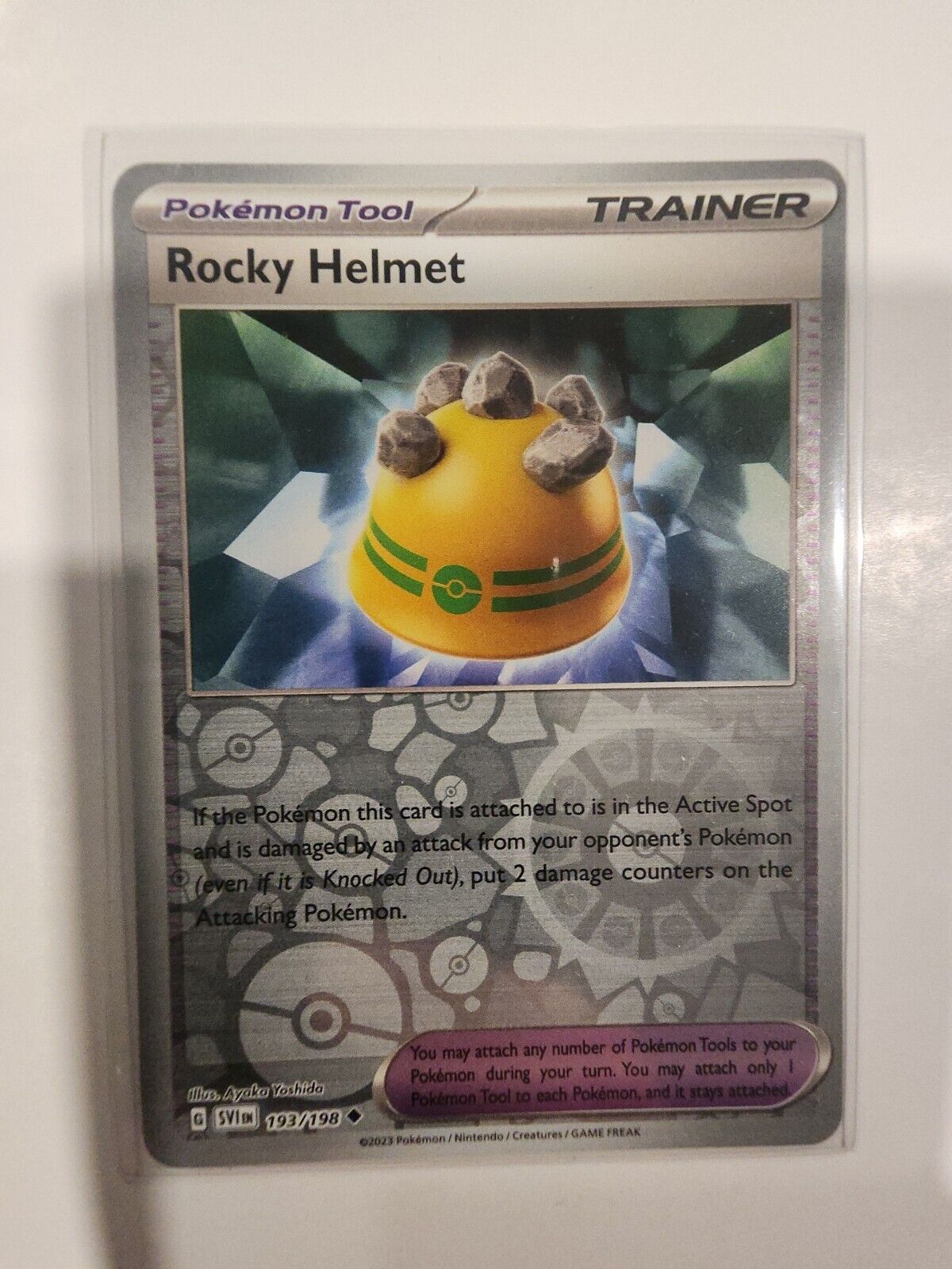 Rocky Helmet [Reverse Holo] 193/198 Pokémon TGC Scarlet & Violet